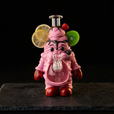 8.8" Cake man water pipe on dark slate surface - Oil Slick Pad