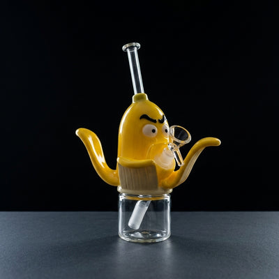8.9'' Banana water pipe on dark slate surface - Oil Slick Pad