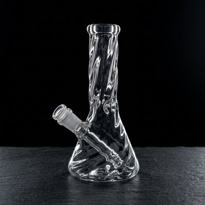 8” Clear Twisted Beaker on dark slate surface - Oil Slick Pad