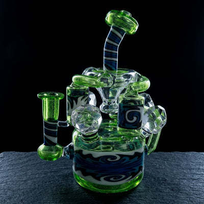 9" 710 Sci Glass Wigwag Triple Can Recycler on dark slate surface - Oil Slick Pad
