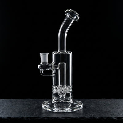 9″ Black Sheep Clear Accent Double Ratchet Rig on dark slate surface - Oil Slick Pad
