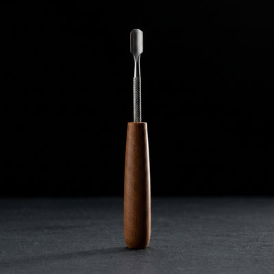 Editorial product photography on charcoal slate