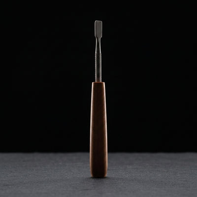 Editorial product photography on charcoal slate