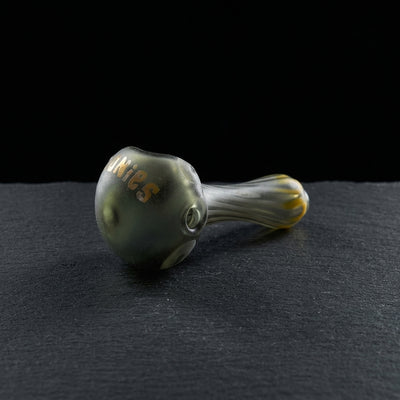 Editorial product photography on charcoal slate