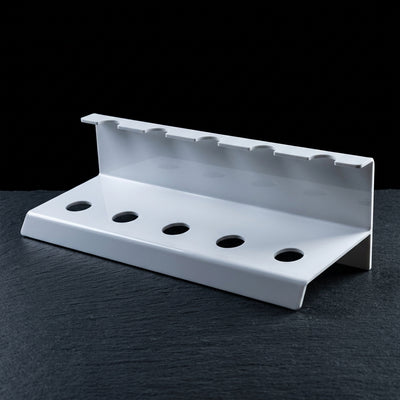 Editorial product photography on charcoal slate