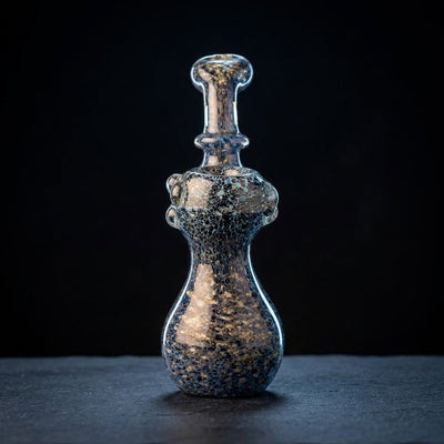 Editorial product photography on charcoal slate