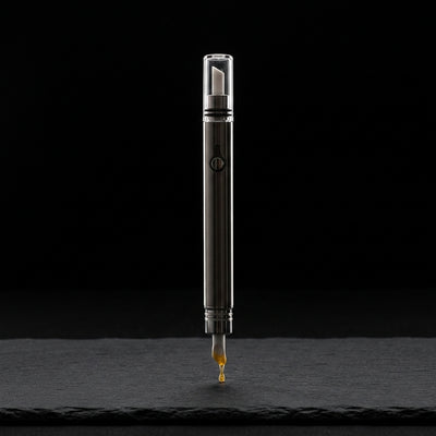 Editorial product photography on charcoal slate
