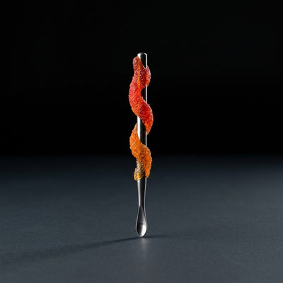Editorial product photography on charcoal slate