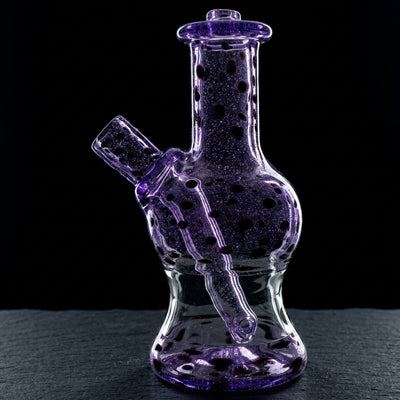 Editorial product photography on charcoal slate