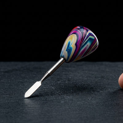 Editorial product photography on charcoal slate