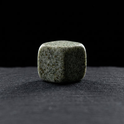 Editorial product photography on charcoal slate