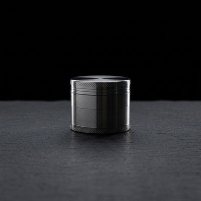 Editorial product photography on charcoal slate