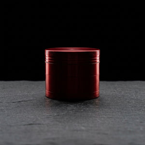 2.5" Classic Zinc Grinder - 1 on dark slate surface - Oil Slick Pad