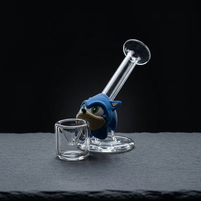 Blue Speed Hedgehog Glass Hand Pipe on dark slate surface - Oil Slick Pad