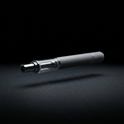 Eo Vape (The Baker) Electronic Nectar Collector on dark slate surface - Oil Slick Pad