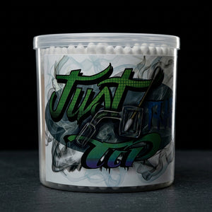Just the Tip Dab Swabs -(6 Containers) 300 Pieces Each on dark slate surface - Oil Slick Pad