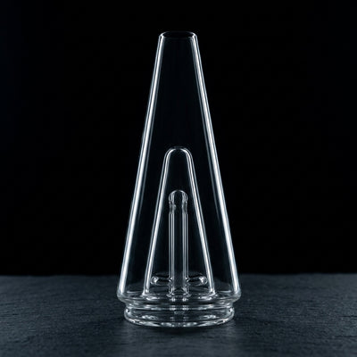 Puffco Peak Glass 2.0 on dark slate surface - Oil Slick Pad