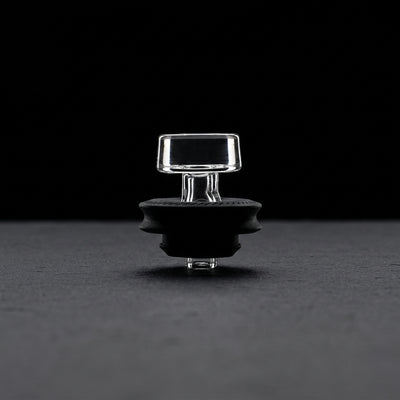 Puffco Peak Pro Black Ball Cap on dark slate surface - Oil Slick Pad