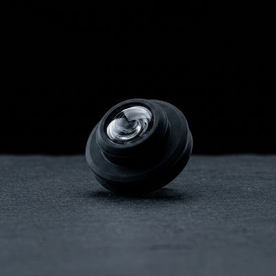 Puffco Peak Pro Oculus Carb Cap on dark slate surface - Oil Slick Pad