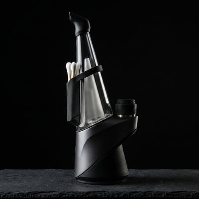Puffco Peak Pro Travel Pack on dark slate surface - Oil Slick Pad