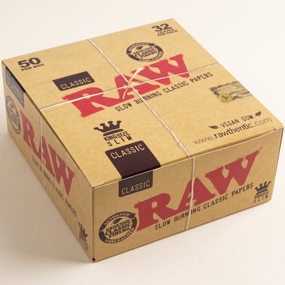 RAW Classic King Size Slim Rolling Papers - Bulk Case (50 Packs, 32 Leaves Each), light background