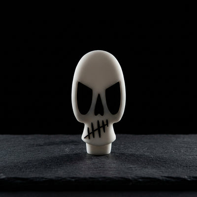 Skull hand pipe on dark slate surface - Oil Slick Pad
