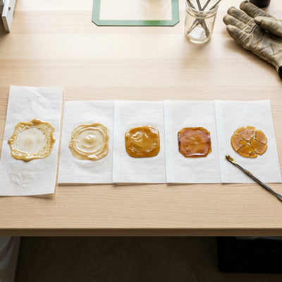 Oil Slick Paper - Workstation with multiple rosin slabs at various collection stages
