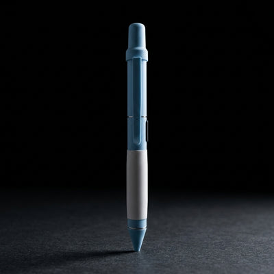 Smyle Penjamin 510 Battery Writing Pen on dark slate surface - Oil Slick Pad