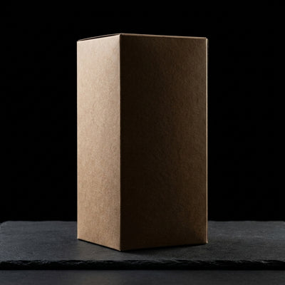 Zig Zag 1 ¼ Bulk Unbleached Cones - (900 Cone Carton) on dark slate surface - Oil Slick Pad
