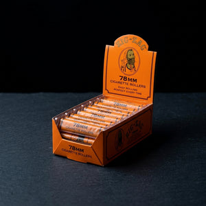 Zig Zag Cigarette Roller 78MM Carton on dark slate surface - Oil Slick Pad